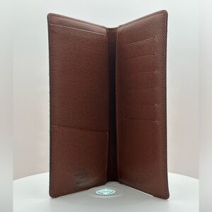 Louis Vuitton 2001 monogram checkbook new without tags. Box and dust bag include